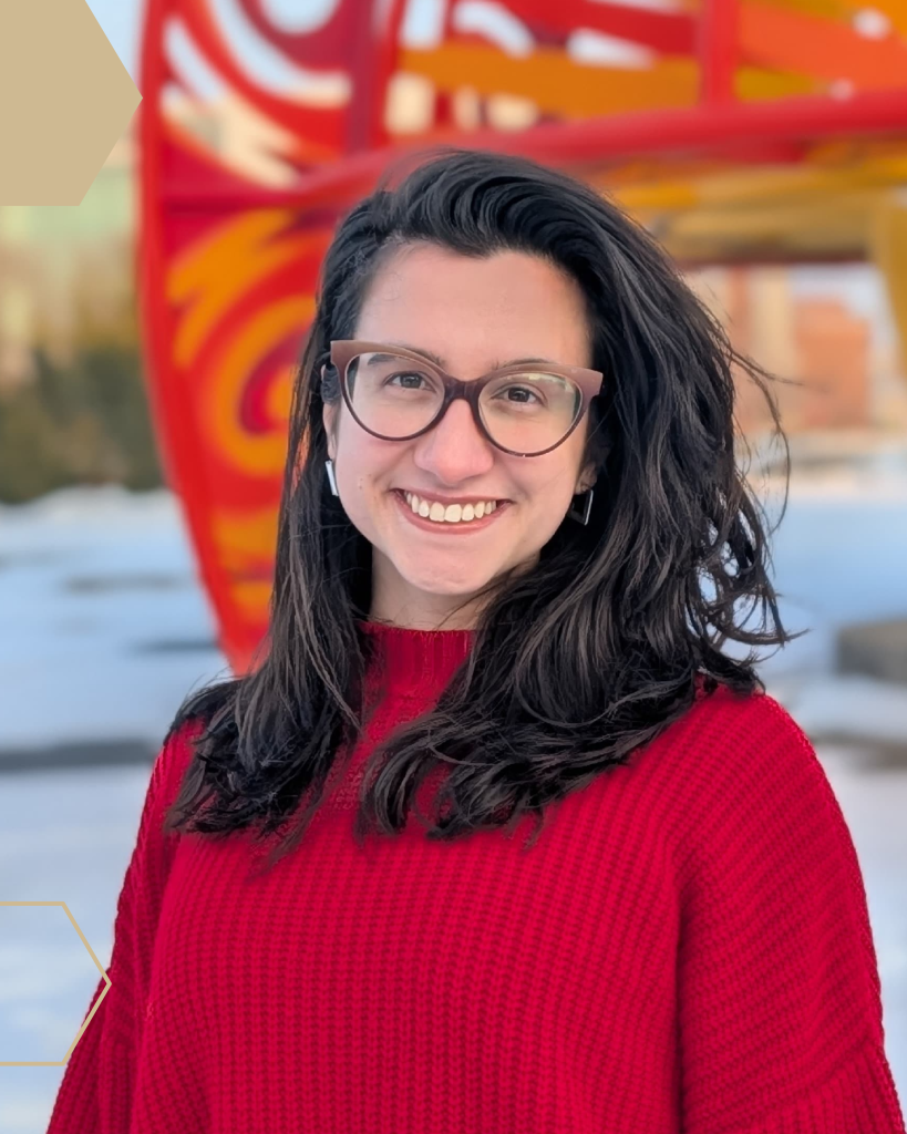 Headshot of Teodora Kljaic standing in front of the Purdue VOSS Model.